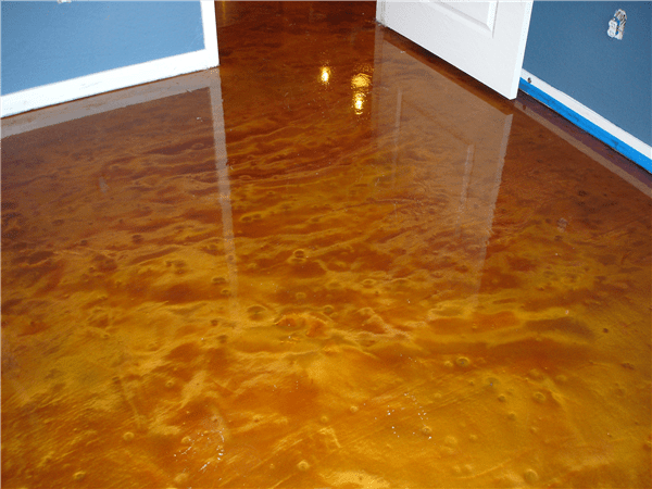 A floor that has been painted with brown and yellow colors.