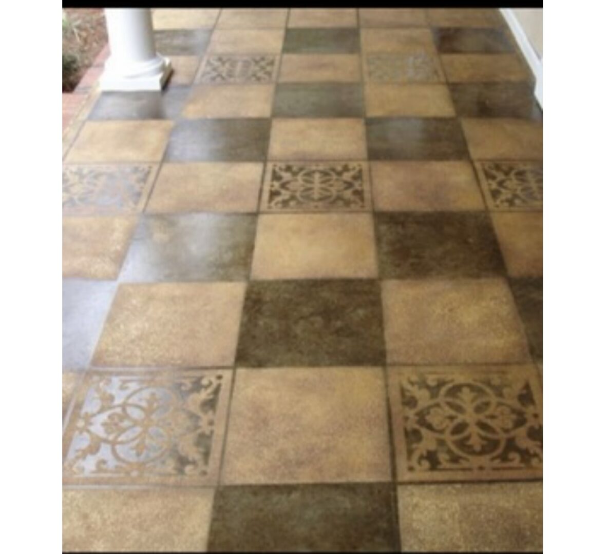 A floor with different colored tiles on it